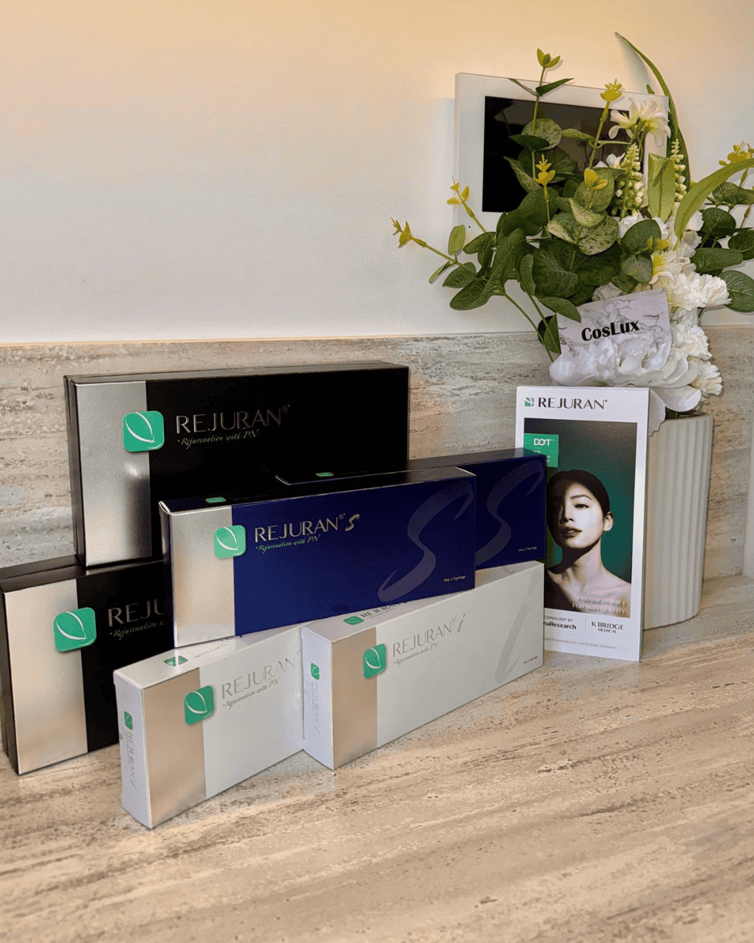 Rejuran products on stone bench with flowers